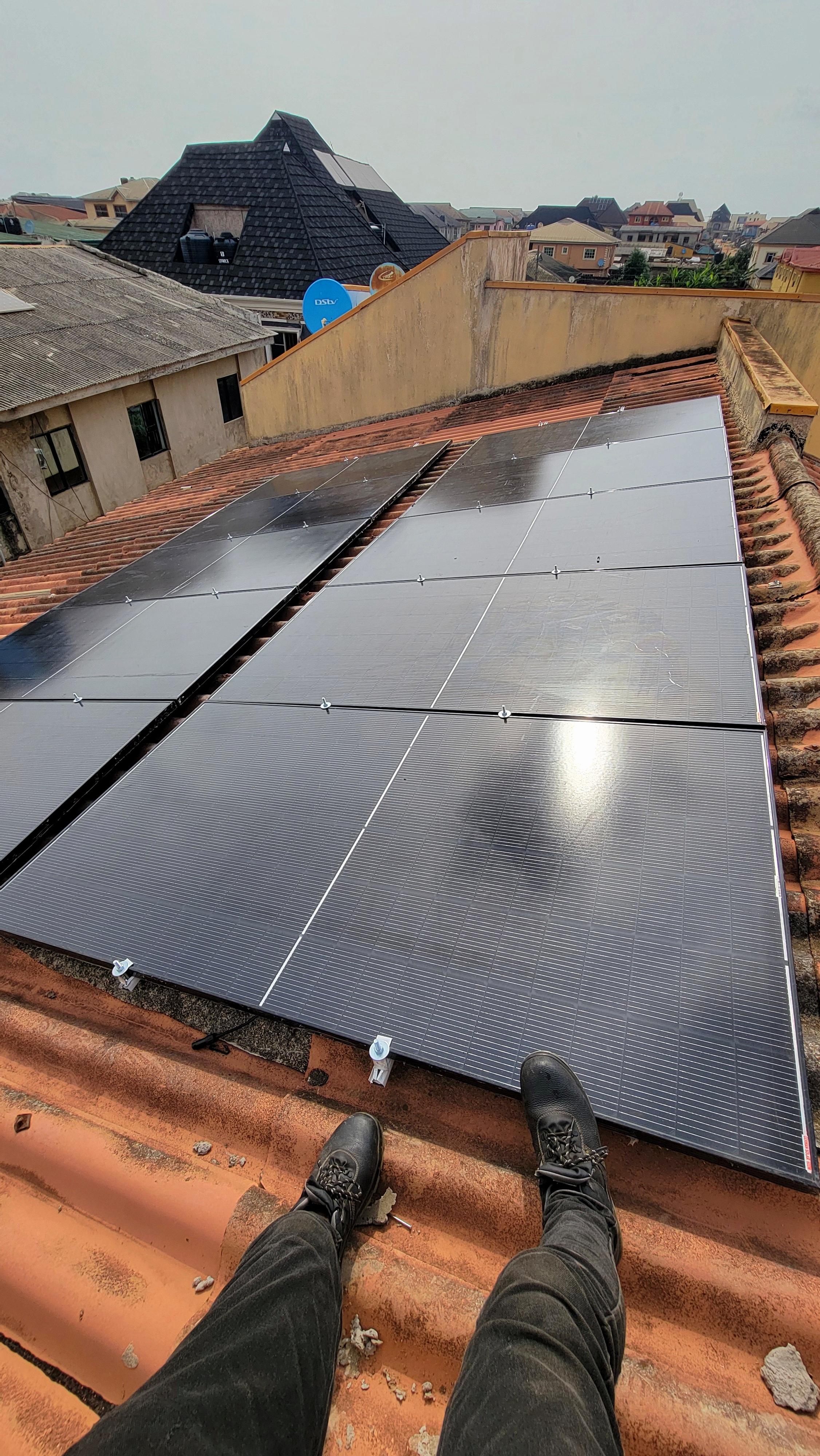 Solar technician installing panels